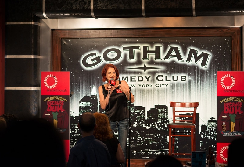 A woman speaks on stage at the Gotham Comedy Club in New York City
