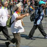 Three women march in San Francisco's Pride parade.